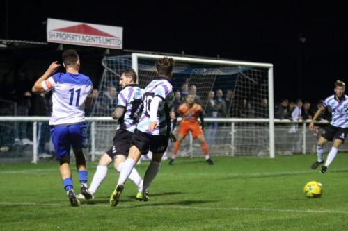 Enfield's Lyle Della-Verde (11) challenged by Freddie Moncur (10) and Reece Prestedge