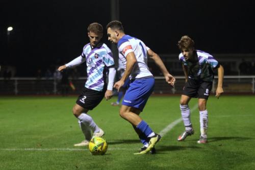 Enfield's Lyle Della-Verde and Margate's Jack Richards (L) and Archie Burnett