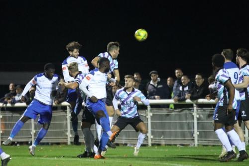 Josh Urquhart (2nd L) heads the game's only goal