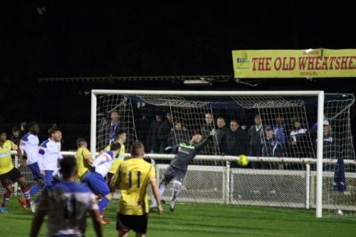 Billy Bricknell (white, R) scores Enfield's equalising goal