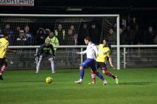 Enfield's Billy Bricknell (white) challenged by Simon Cooper