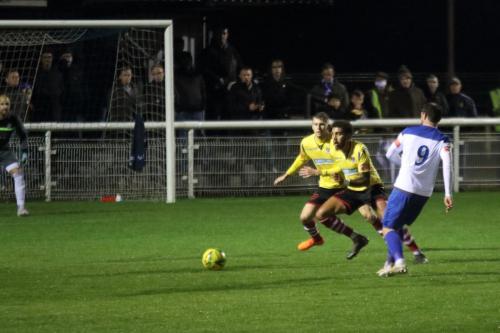 Enfield's Billy Bricknell and Kingstonian's Ollie Cook (L) and Harry Osborne