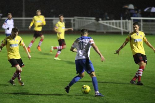 Enfield's Lyle Della-Verde and Kingstonian's Tom Richards (L) and Fabio Saraiva