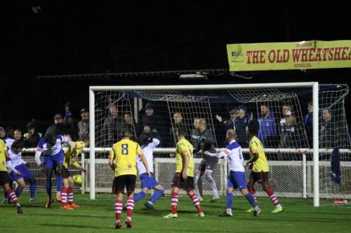 Enfield's Marc Weatherstone (white, 2nd L) heads the ball goalwards. The ball ends up in the net, followed up by Josh Urquhart (centre), for the winning goal.