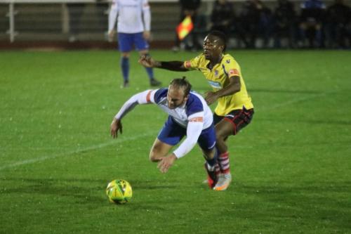 Enfield's Scott Thomas (L) upended by Kadell Daniel