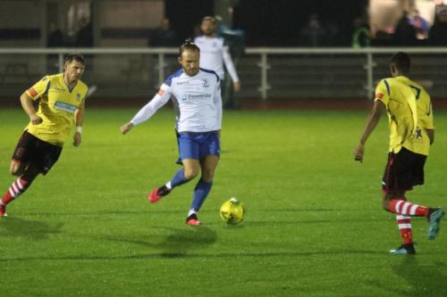 Enfield's Scott Thomas and Kingstonian's Kenny Beaney (L) and Gus Sow