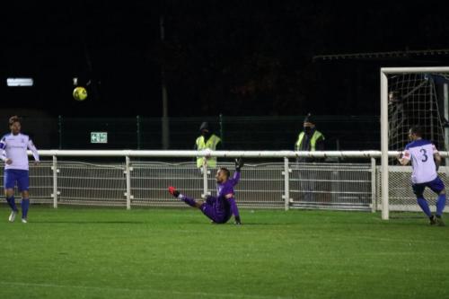 Enfield keeper Nathan McDonald blocks a shot