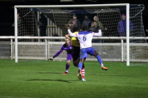 Having lost the ball to Corie Andrews, Enfield's Adam Pepera (6) resists the tempatation to bring him down and risk a red card