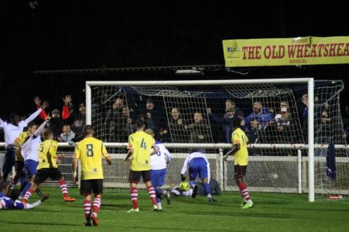 Josh Urquhart (white, R) follows up to make sure Marc Wetherstone's header has crossed the line for the winning goal