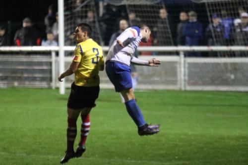 Kingstonian's Fabio Saraiva (L) and Enfield's Sam Youngs