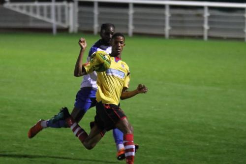 Kingstonian's Gus Sow (yellow) and Enfield's Adam Pepera