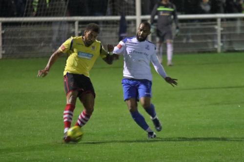 Kingstonian's Harry Osborne (L) clears from Jared Small