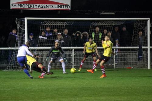 Kingstonian's Harry Osborne blocks from Jared Small
