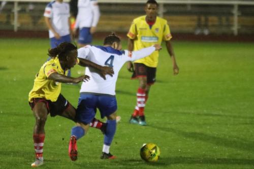Kingstonian's Kadell Daniel (L) and Enfield's Scott Thomas