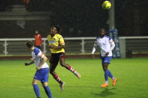 Kingstonian's Kadell Daniel and Enfield's Lee Chappell (L) and Adam Pepera