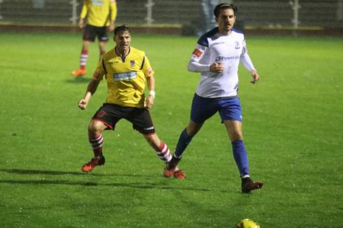 Kingstonian's Kenny Beaney (L) and Enfield's Sam Youngs