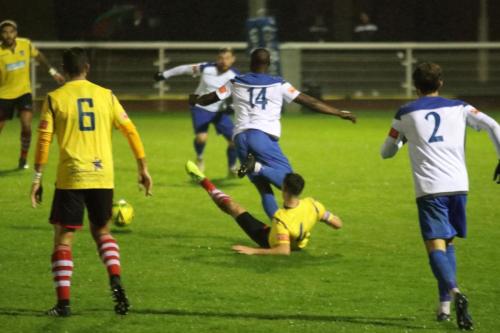 Kingstonian's Simon Cooper tackles Percy Kiangebeni