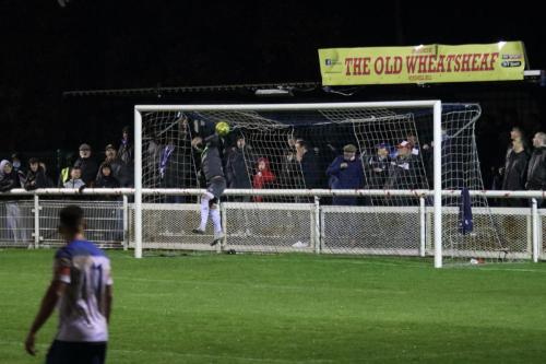 Kingstonian keeper Rob Tolfrey has to back-pedal as a long-range shot drops just over the bar
