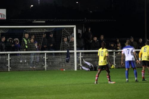 Kingstonian keeper Rob Tolfrey turns a free kick round the post