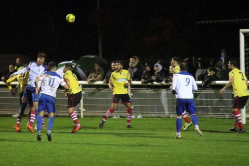 Marc Weatherstone (white, L) heads across goal
