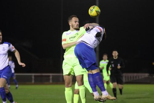 Enfield's Billy Bricknell (R) challenges Martyn Stokes