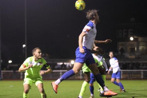 Enfield's Adam Cunnington heads the ball on