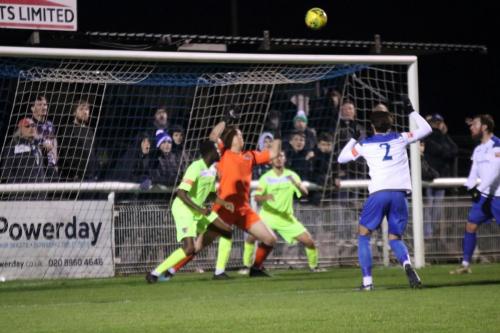 Enfield's Josh Urquhart (2) heads over the bar