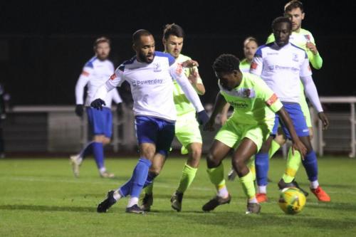 Enfield's Jared Small (L) pushes the ball past Makhosini Khanye