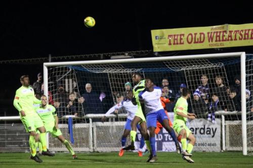 Enfield's Jeremiah Gyebi (white, L) challenges Shomari Barnwell