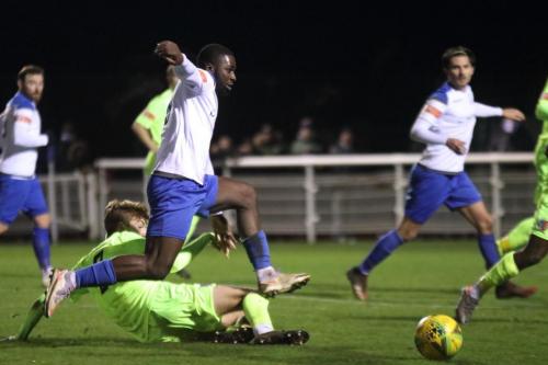 Maldon's Bradley McClehaghan (green) challenges Percy Kiangebni