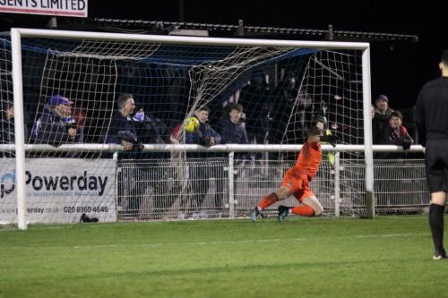 Percy Kiangebeni scores the final Enfield penalty to level at 3-3