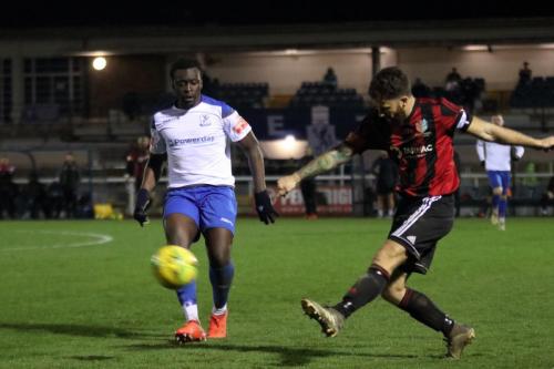 Brightlingsea's Pip Boyland clears from Neville Nzembela