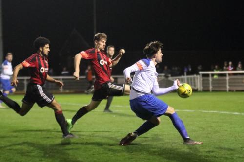 Enfield's Sam Youngs and Brightlingsea's Cadell Fraser-Robinson (L) and Adam Topley