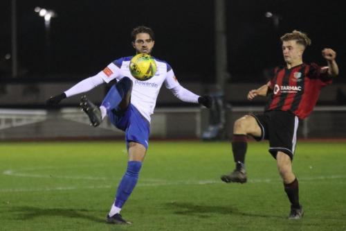 Enfield's Josh Urquhart (L) and Brightlingsea's Kane Gilbert