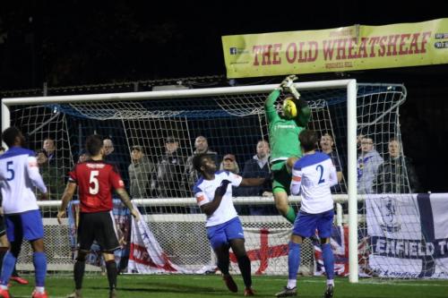 Brightlingsea keeper Charlie Turner somehow managed to catch this ball.