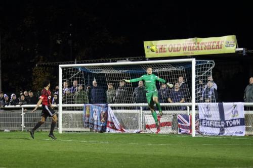 Brightlingsea keeper Charlie Turner watche the ball drop just over the bar
