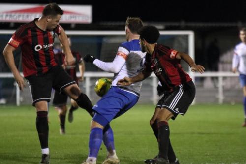 Brightlingsea's Joe Heron (L) and Cadell Fraser-Robinson and Enfield's Billy Bricknell