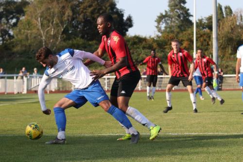 Enfield's Josh Urquhart (L) and Lewes' Merrick James-Lewis
