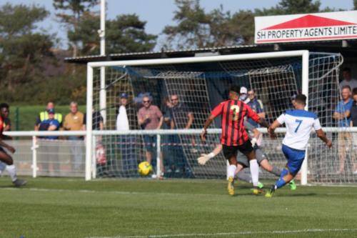 Enfield's Lyle Della-Verde (7) crosses to set up the opening goal