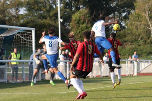 Enfield's Sam Youngs (8) and Jeremiah Gyebi attack the ball at a set piece