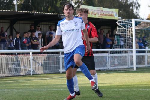 Enfield's Sam Youngs (front) and Lewes' Tegan Freeman