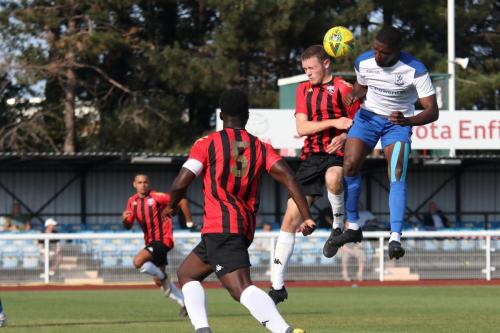 Enfield's Shaun Okjie (R) challenges Nic D'Arienzo