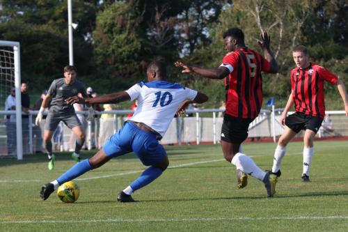 Enfield's Shaun Okojie (10) tries to turn past Christian Frimpong
