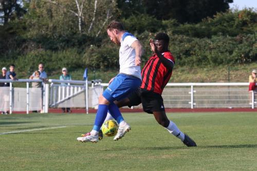 Lewes' Christian Frimpong (R) challenges Billy Bricknell