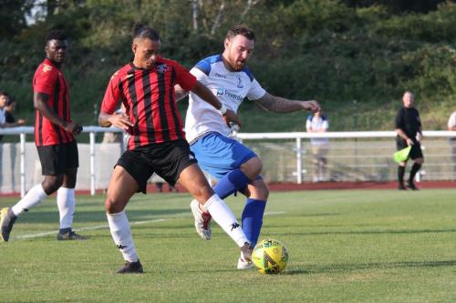 Lewes' Leon Redwood (L) challenges Billy Bricknell
