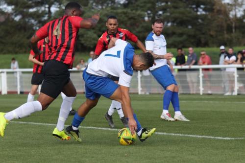 Lewes' Merrick James-Lewis (L) and Enfield's Lyle Della-Verde
