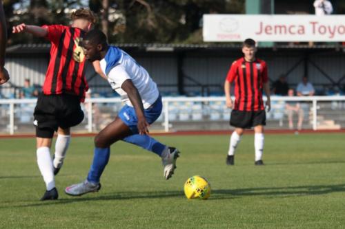 Lewes' Tegan Freeman (L) and Enfield's Percy Kiangebeni