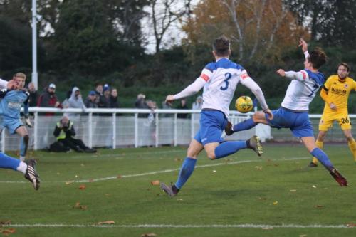 A cross just eludes Enfield's Sam Youngs and Lee Chappell (3)
