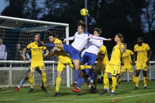 Enfield's Sam Youngs (white, L) and Lewis Taaffe attack the ball