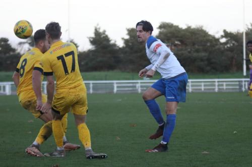 Enfield's Sam Youngs and Ramsgate's Mitchell Chapman (8) and Tom Chapman